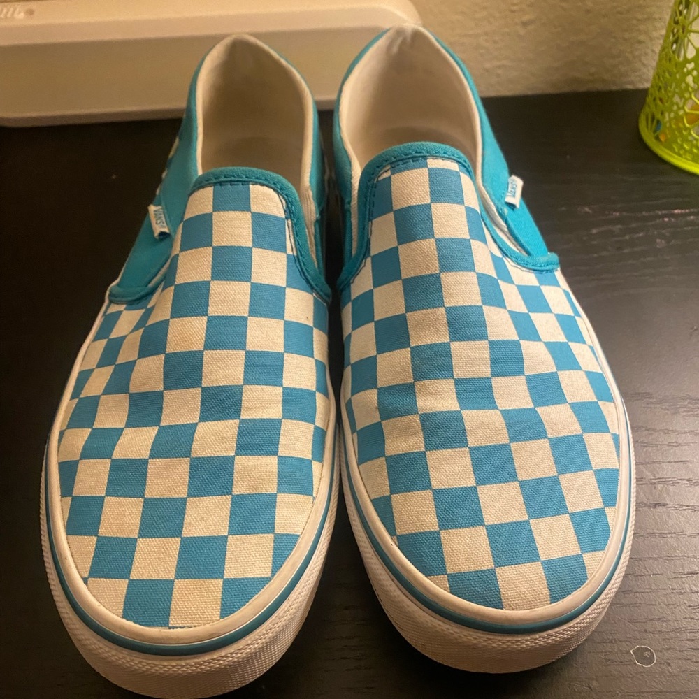 I am selling these teal and white slip on vans.